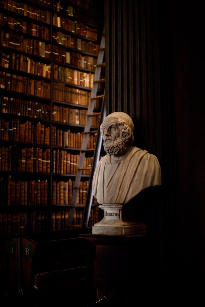 Bust of ancient philosopher in dimly lit library with tall bookshelves (Incomplete: max_output_tokens)