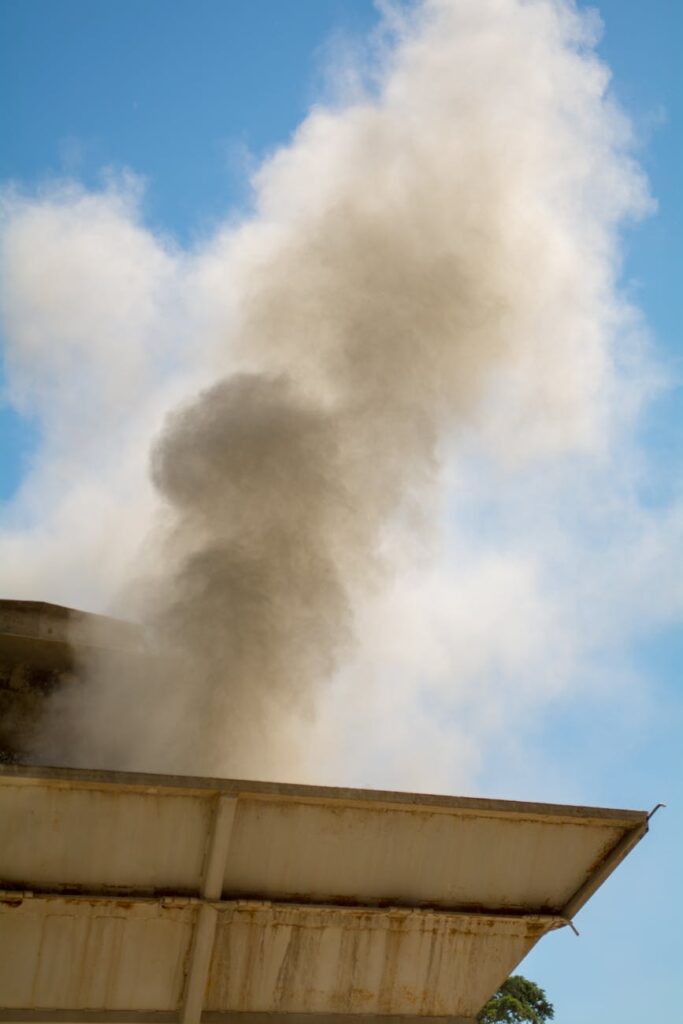Thick smoke rising from a rooftop under (Incomplete: max_output_tokens)