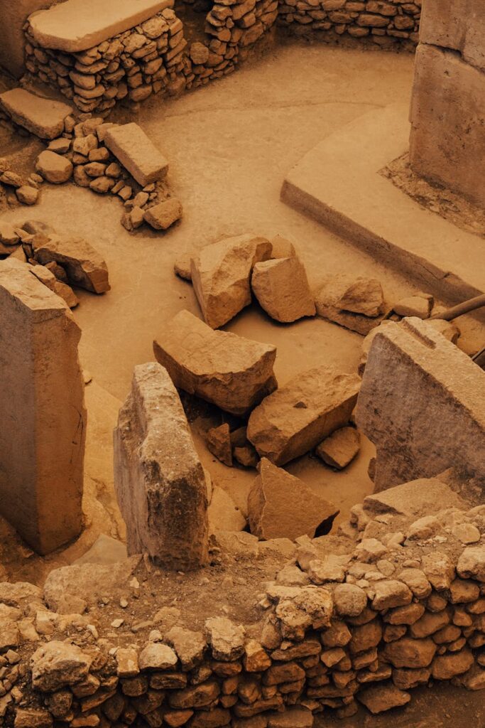 Ancient stone ruins with circular structures at an archaeological site
