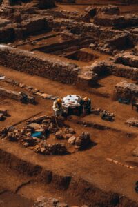 Aerial view of ancient stone ruins at an archaeological excavation site