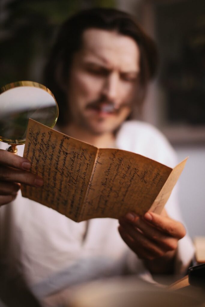 Man examining old handwritten letter with magnifying glass (Incomplete: max_output_tokens)