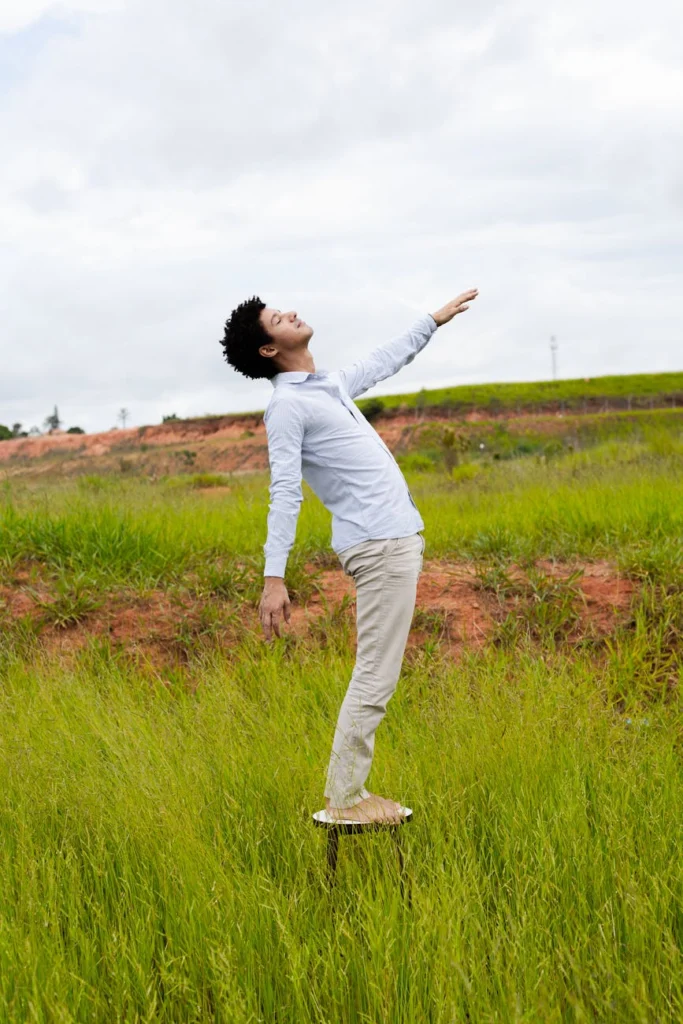 Man levitating above grass in an open field under the sky (Incomplete: max_output_tokens)
